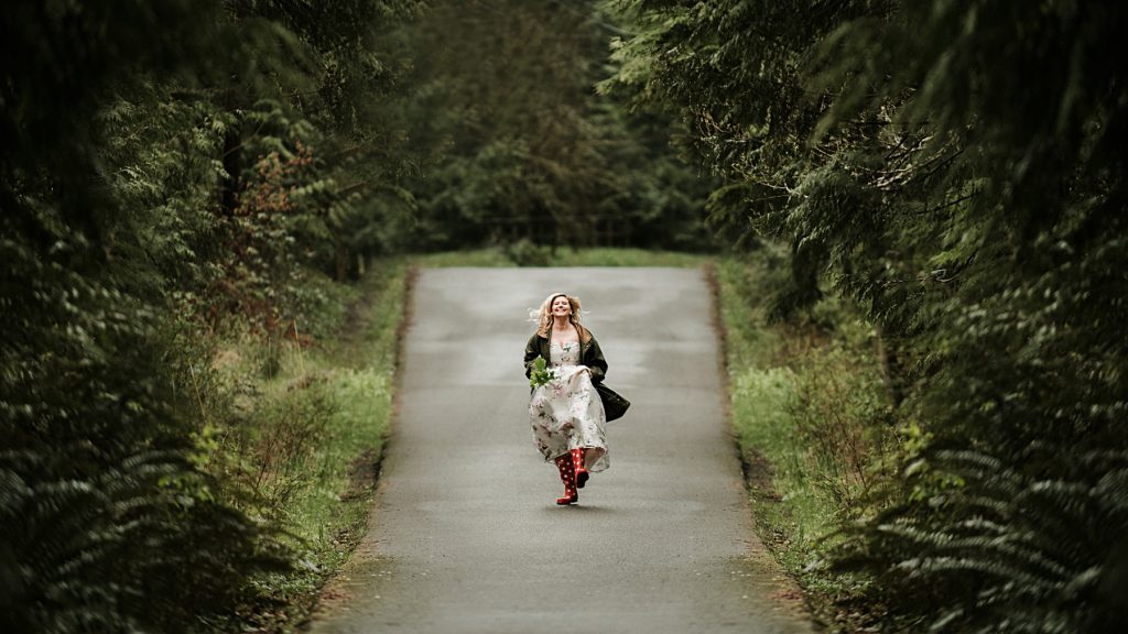 Bride to be running down a path during Engagement Photos in Cle Elum