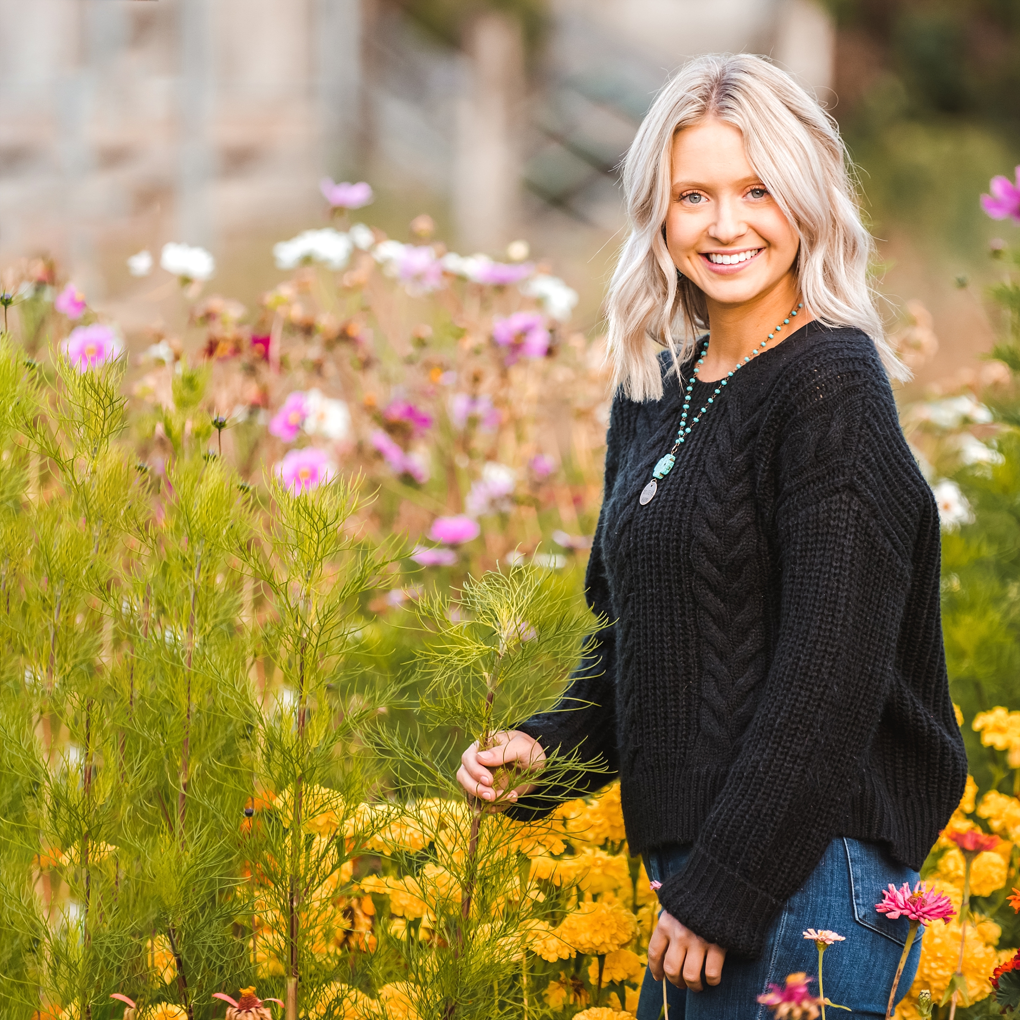 Teenage Girl Posing in field of flowers during Fall Family Photographs in Ellensburg at Ritter Farms