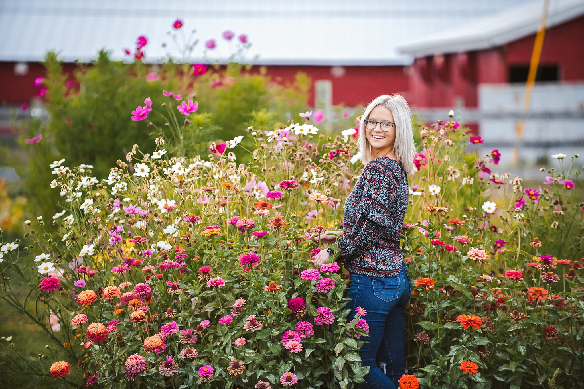 Girl Posing in Wild Flowers for Fall Family Photographs in Ellensburg at Ritter Farms