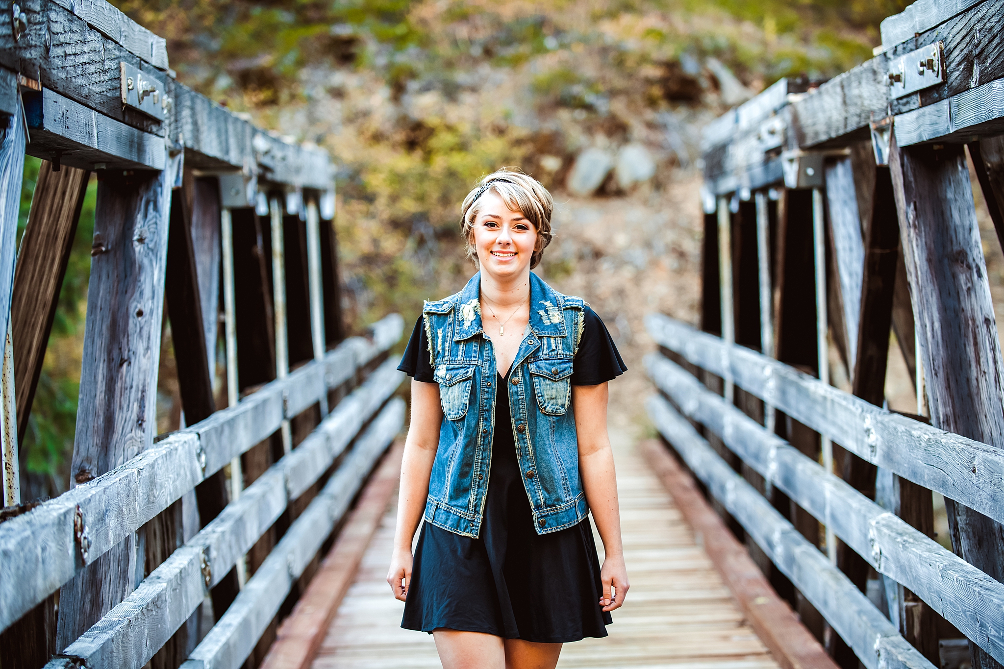 Pretty teenage girl walking down wooden bridge Cle Elum Senior Photography