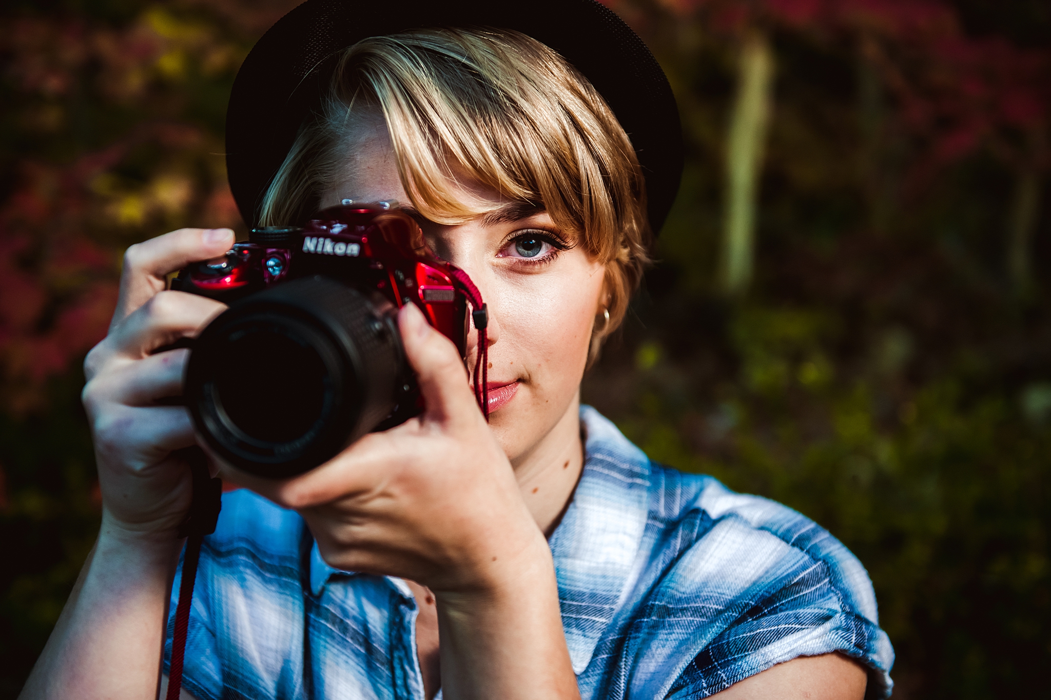 Girl holding a camera during Cle Elum Senior Photography Session