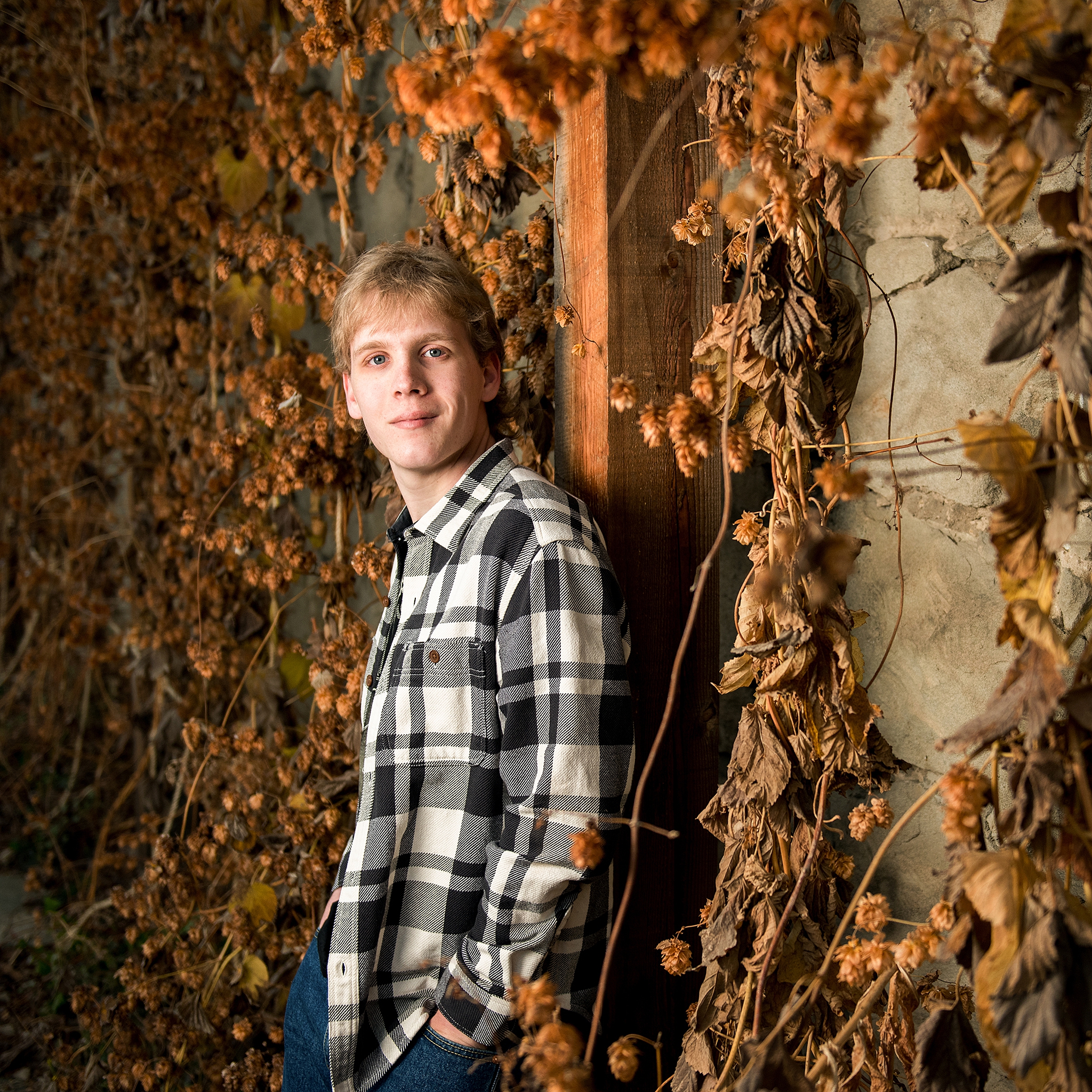 High school Senior Portraits in Roslyn against an ivy covered brick wall