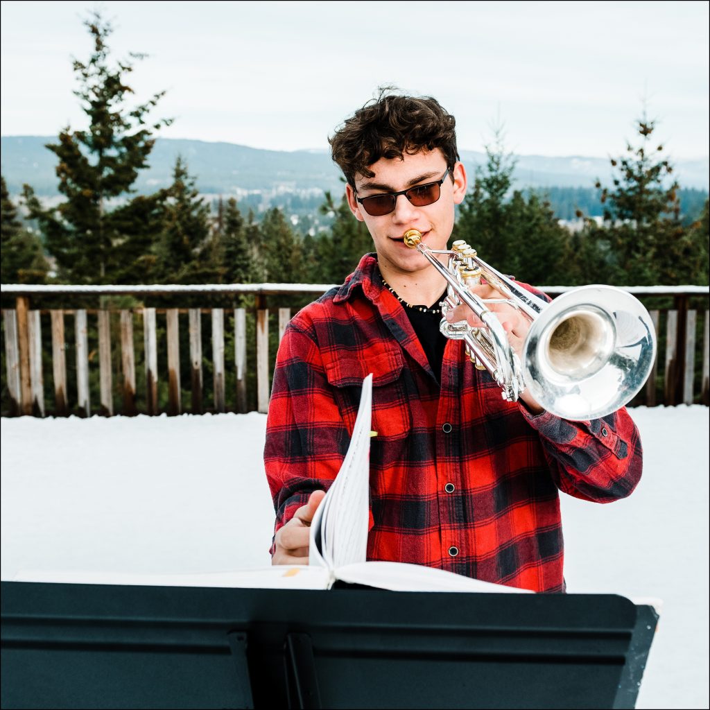 highschool student playing trumpet in winter