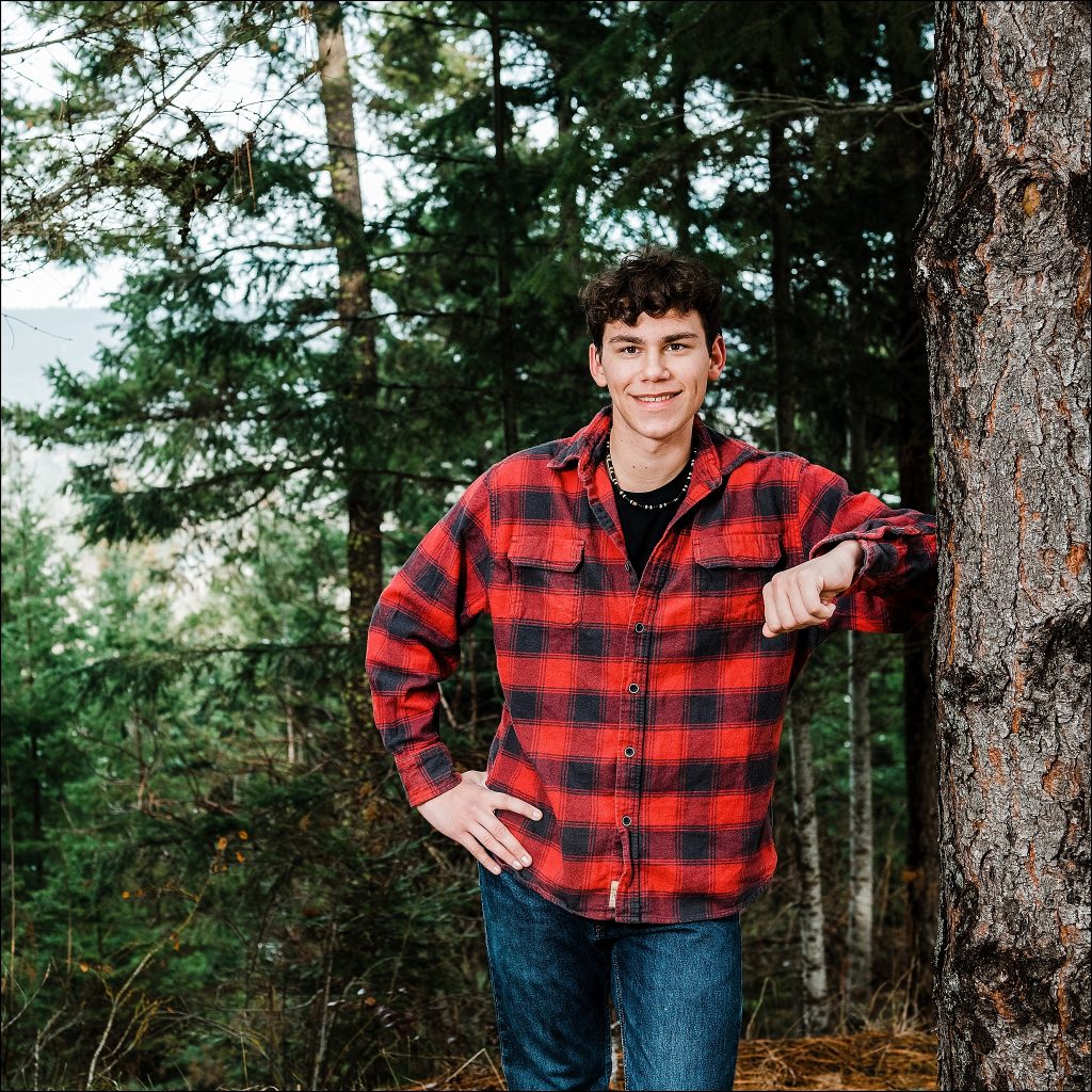 photo of guy in plaid in the woods senior photographer in cle elum