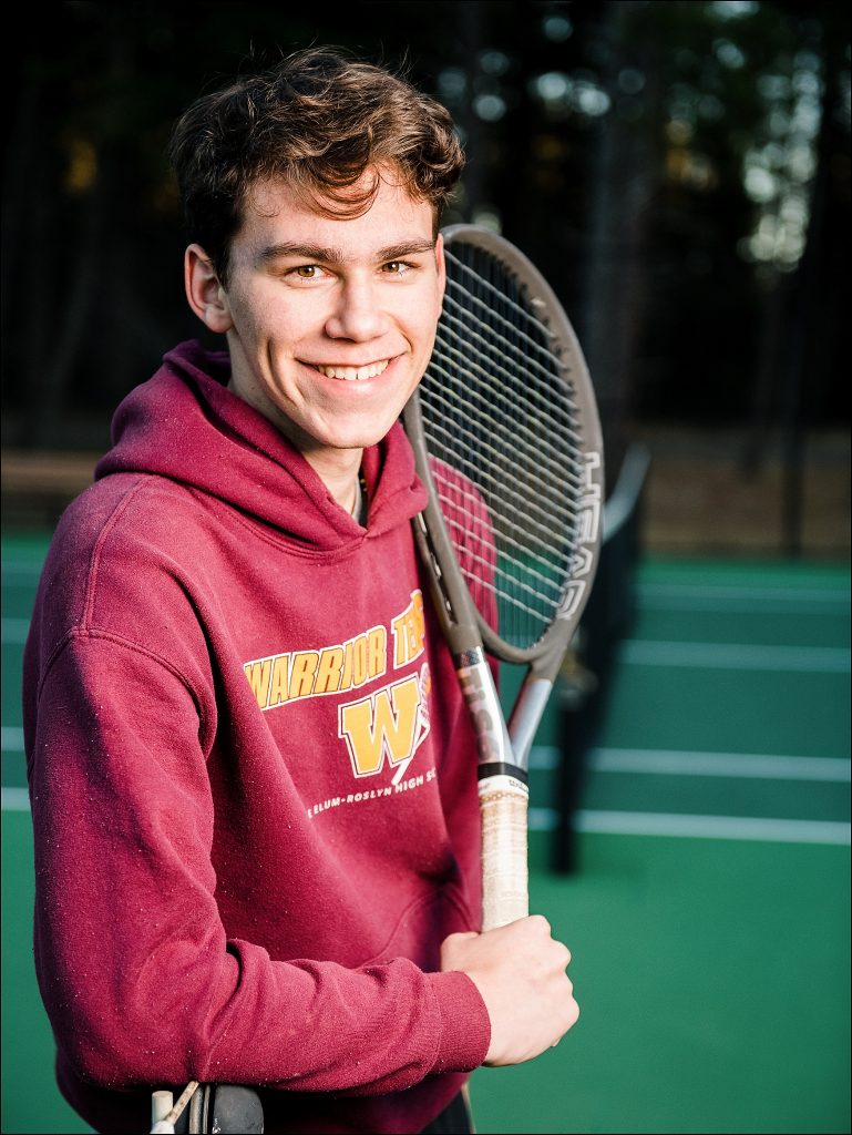 photo of high school boy holding tennis racquet senior photographer in cle elum