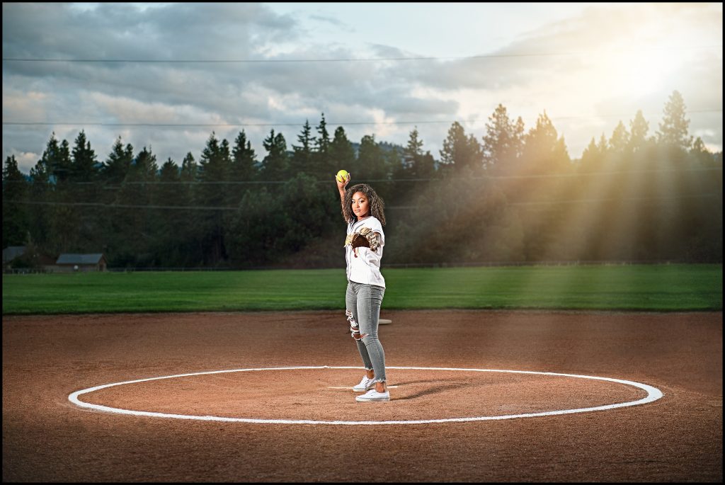 Ellensburg Senior Portraits of girl on softball field 
