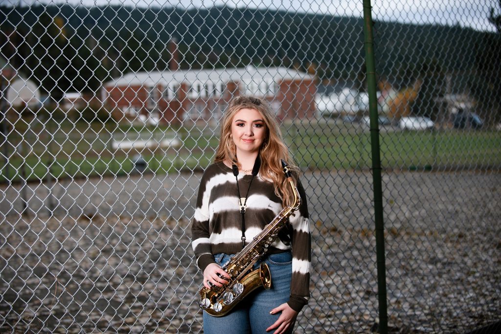Pretty highschool senior girl posing with her saxophone in Cle Elum Washington