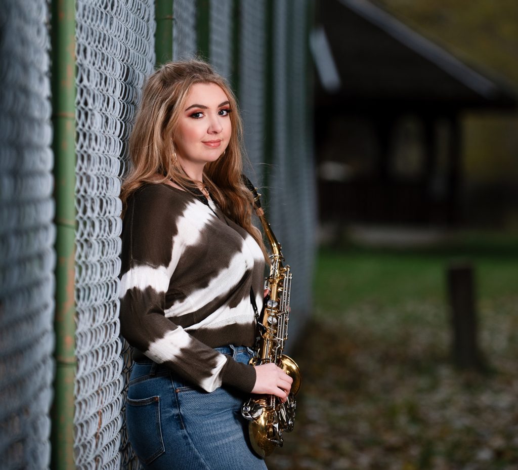 Pretty highschool senior girl posing with her saxophone in Cle Elum Washington