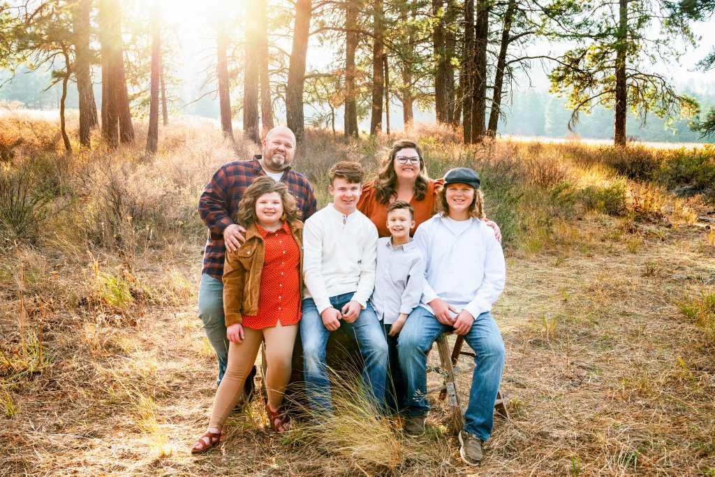 Roslyn Family Photographer an image of a family with four children in a grassy meadow