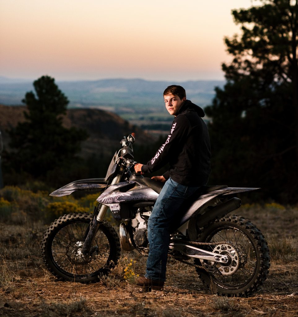 Guy posing with dirt bike in Ellensburg Washington