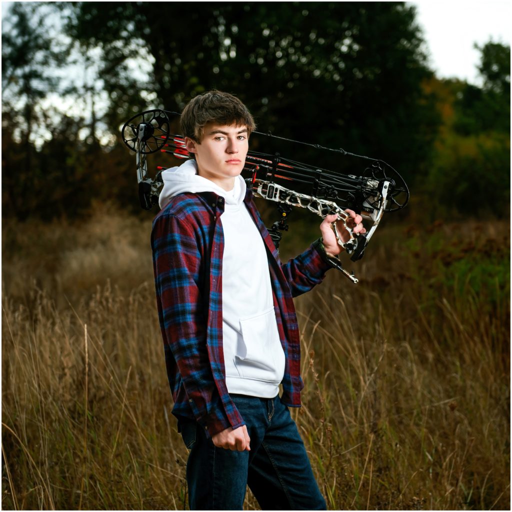 senior pictures taken with hunting gear PNW