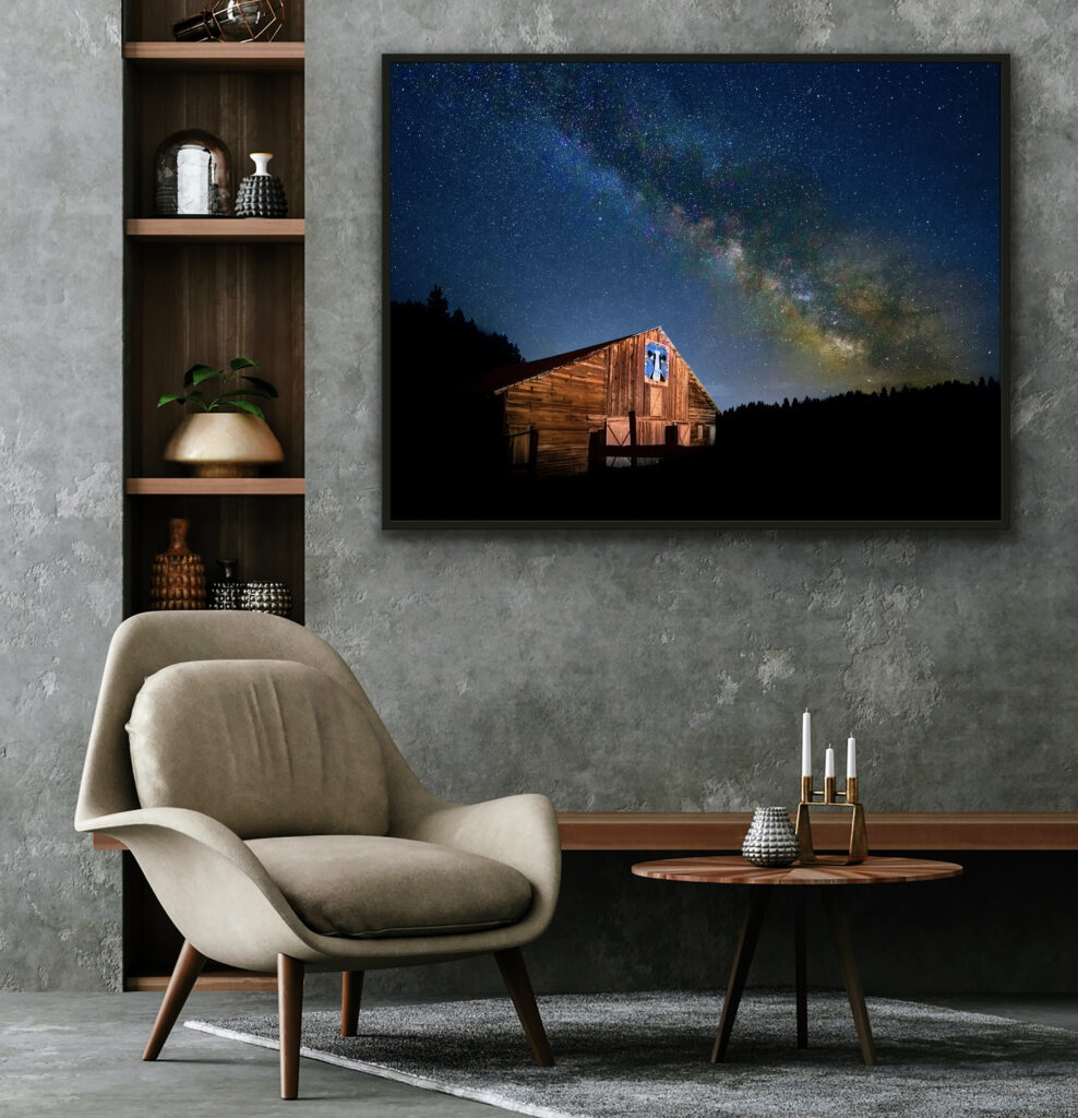 A framed photo displays Nelson Farm and the milky way above it 